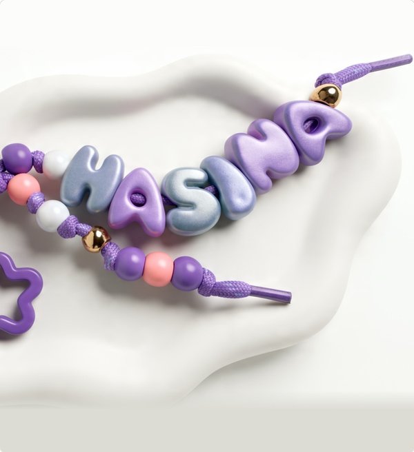 Lilac bubble-letter keychain spelling HASINA
