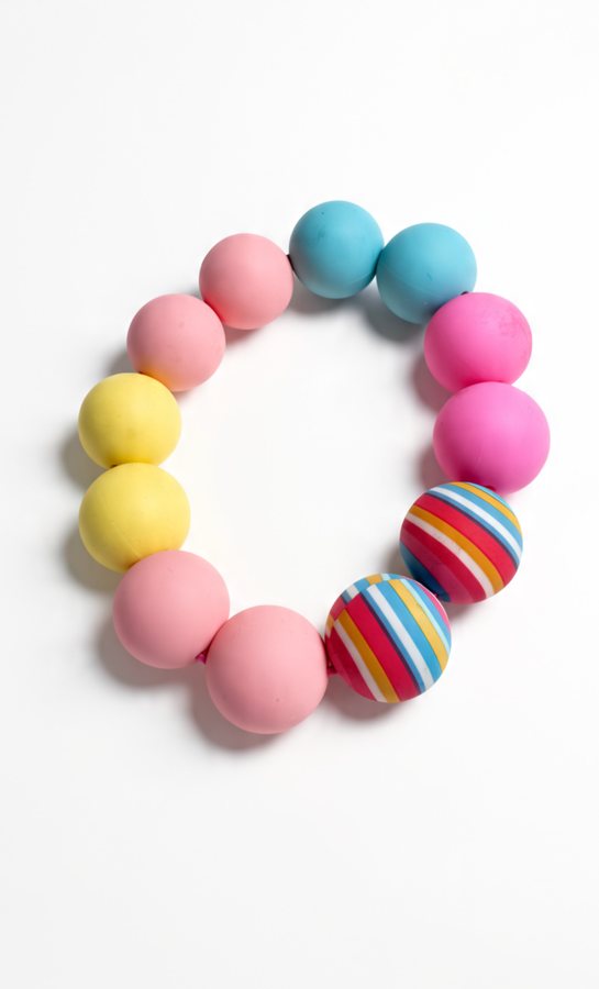 Chunky silicone bracelet with pink, yellow, blue and striped beads