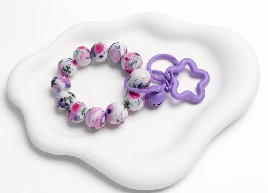 Floral silicone bead wristlet with a lavender clasp and star ring