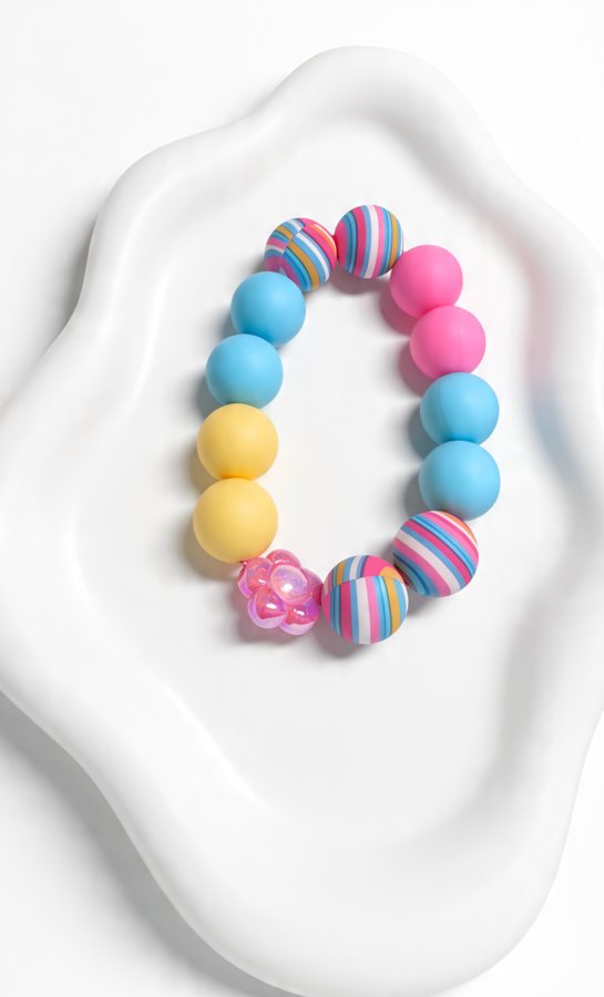Silicone bracelet with striped beads and a pink flower bead