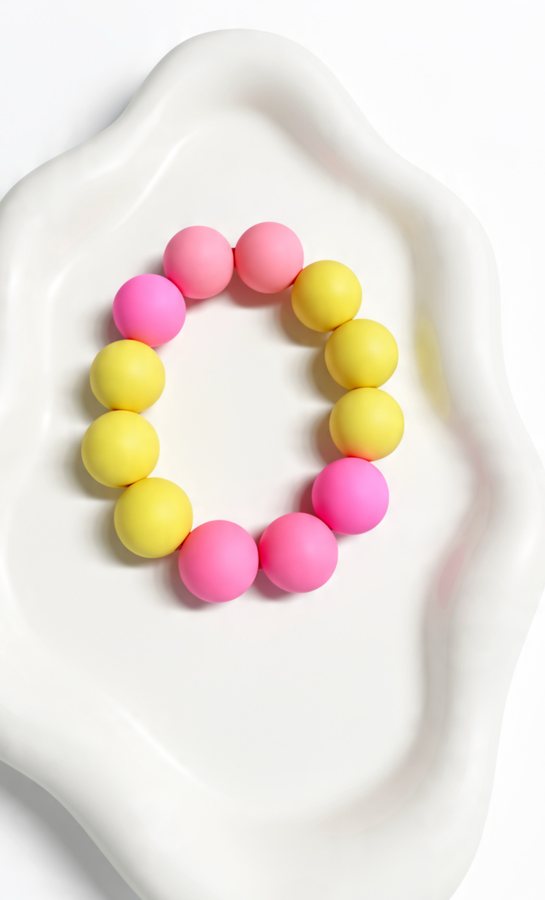 Bright pink and yellow silicone bead bracelet