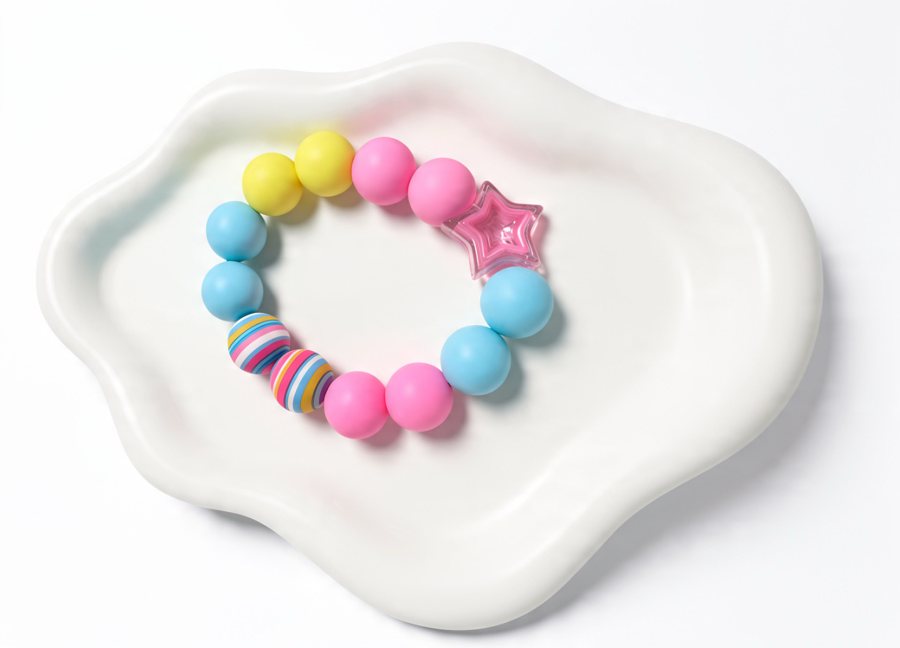 Silicone bracelet with a clear pink star bead